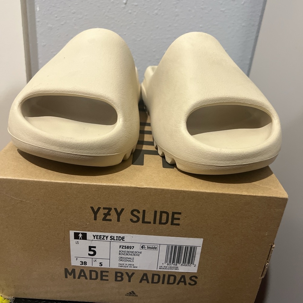 Yeezy Slides in Bone color Size 5 US 
Somewhat  worn